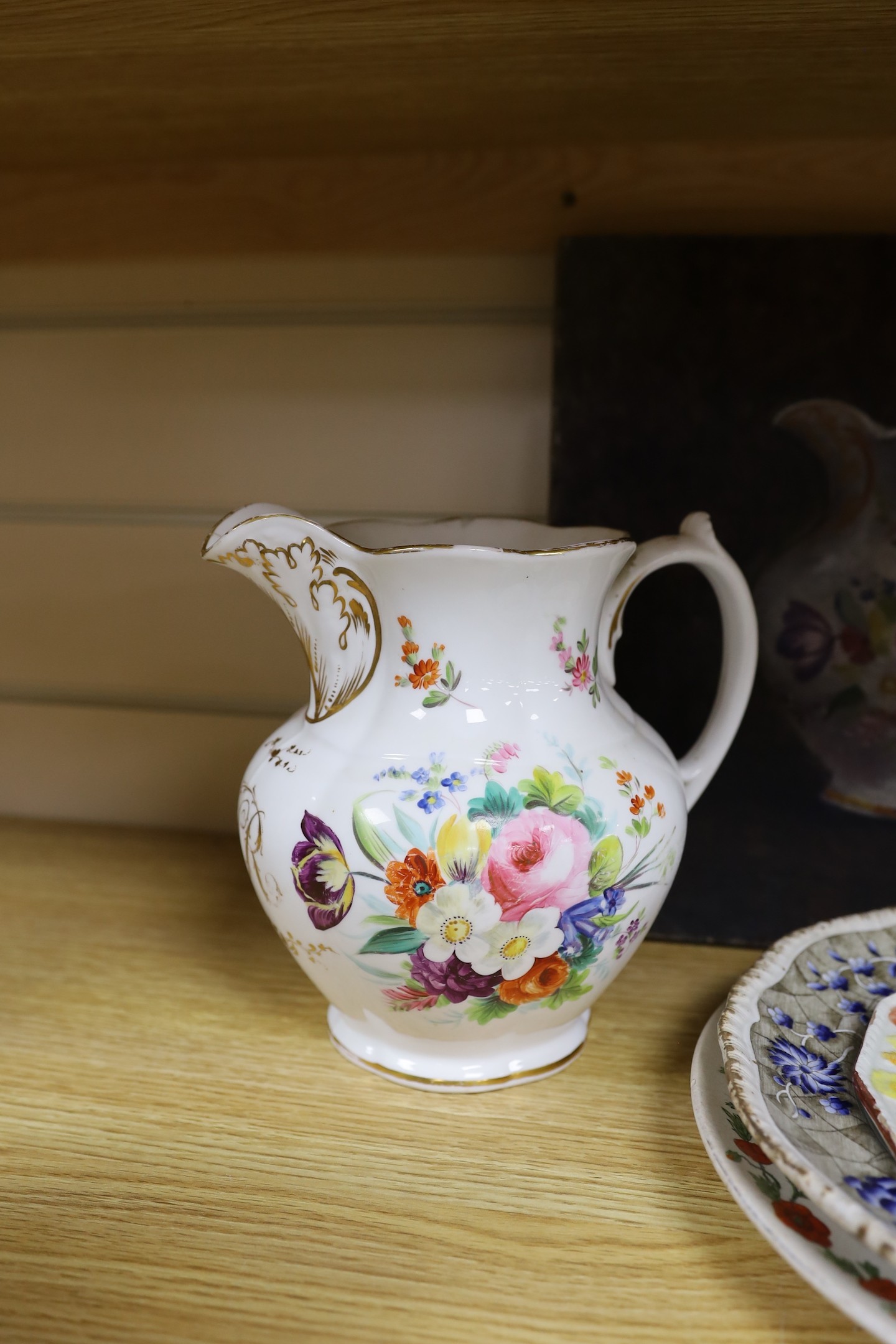 An early Victorian bone china jug, 19.5cm tall, related oil on canvas, three plates and continental vase